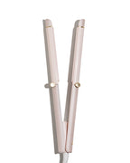 Pink hair straightener on a white background