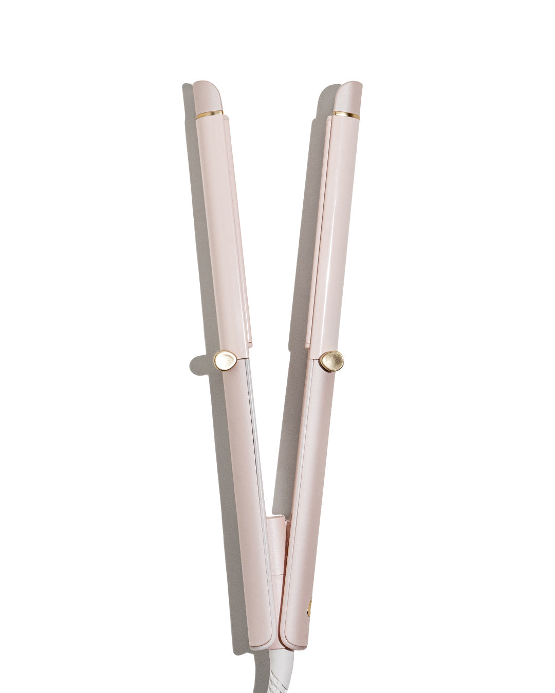 Pink hair straightener on a white background