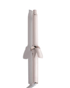 Pink hair curler on a white background